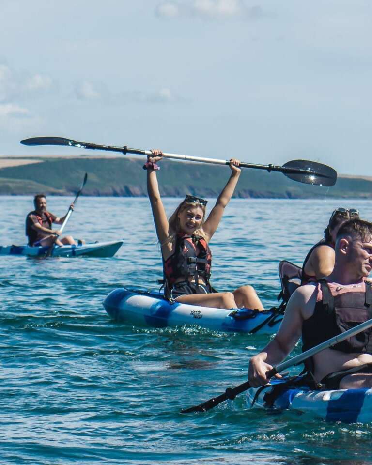 Kayakers celebrating on Cork Harbour with Funkytown
